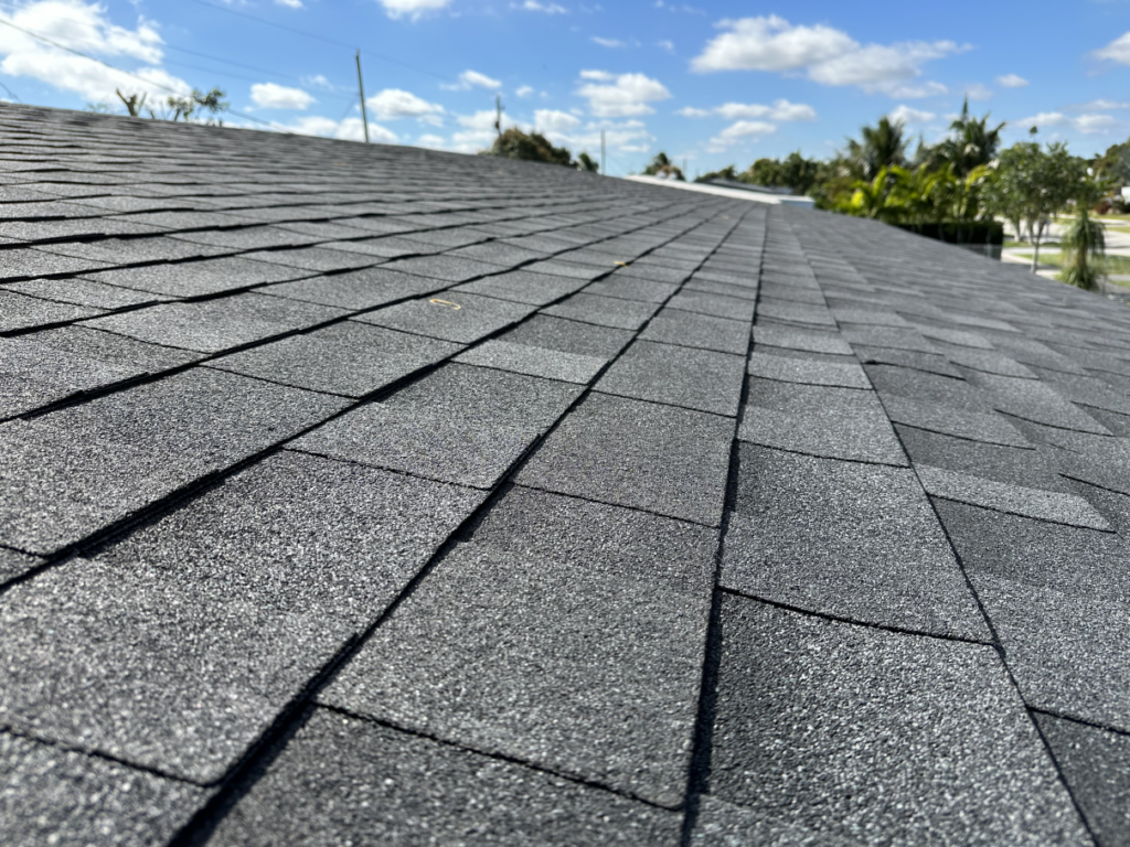 Close view of gray asphalt shingles on a roof
