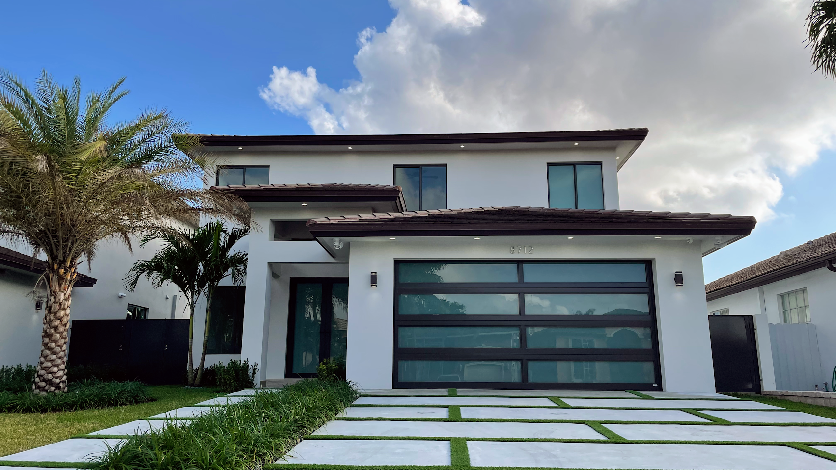 Black-framed windows installed by Click Construction & Roofing